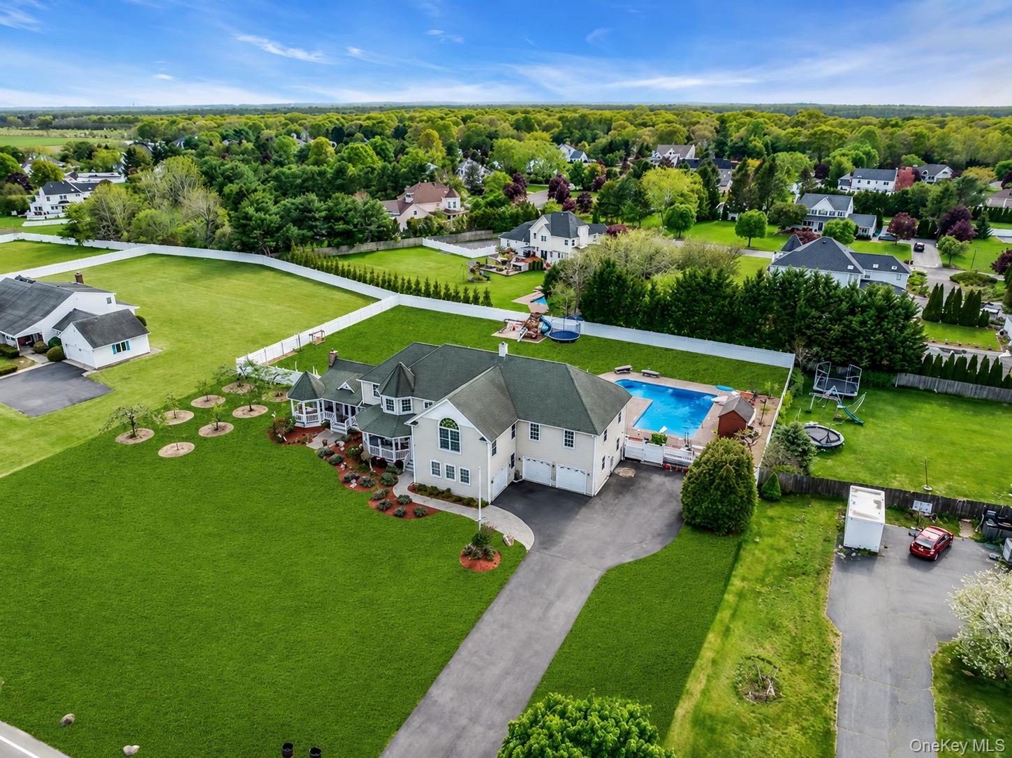 1509 Wad Riv Mnrvl Road Wading River, NY 11792 - Photo 1 of 19 an aerial view of a house with a garden and yard