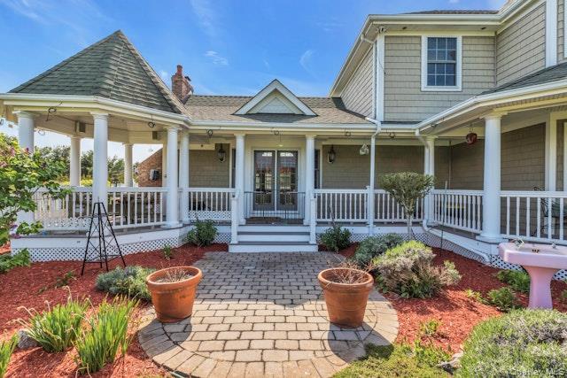 1509 Wad Riv Mnrvl Road Wading River, NY 11792 - Photo 5 of 19 a view of a house with a backyard and garden