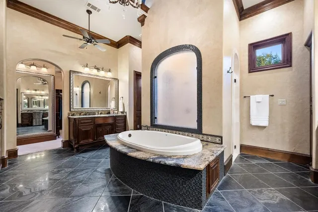 a living room with couches a dining table and chairs with wooden floor