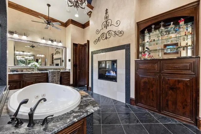 a kitchen with granite countertop a stove and cabinets