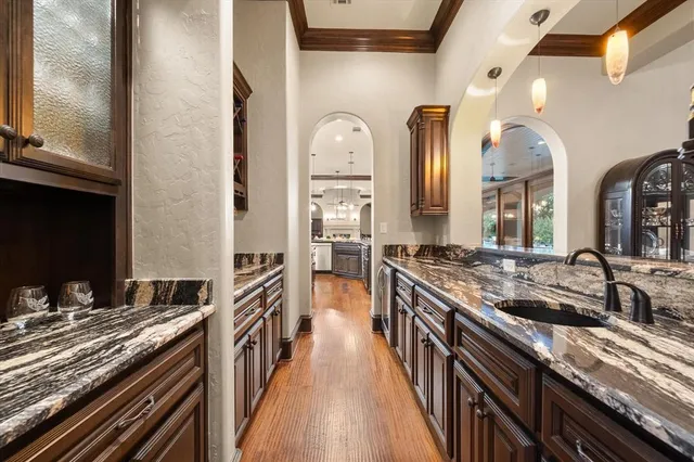 a kitchen with stainless steel appliances granite countertop a stove and a sink
