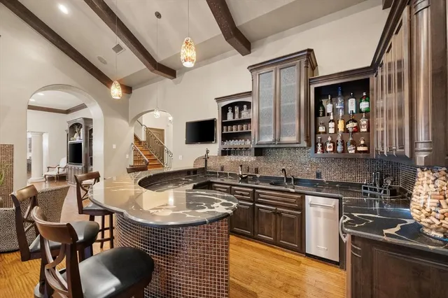a kitchen with stainless steel appliances granite countertop a stove and a sink