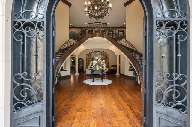 a view of a entryway door with wooden floor