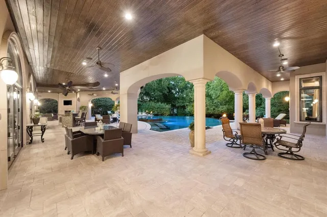 a view of the patio with chairs and tables