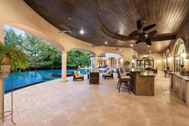 a view of a patio with chairs and a table