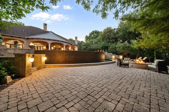 a view of a yard with cars