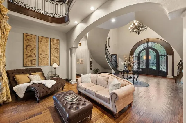 a living room with furniture a fireplace and wooden floor