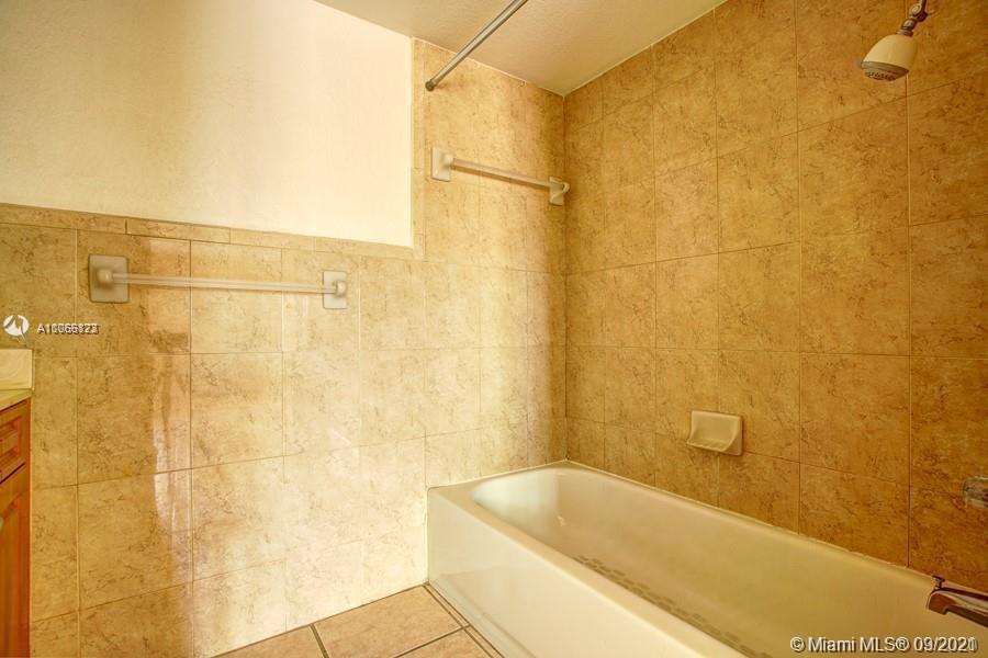 637 Southwest 3rd Street, Unit 206 Miami, FL 33130 - Photo 1 of 20 a bathroom with a bathtub and shower
