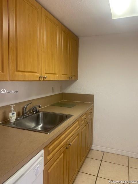 637 Southwest 3rd Street, Unit 206 Miami, FL 33130 - Photo 11 of 20 a kitchen with a sink and cabinets