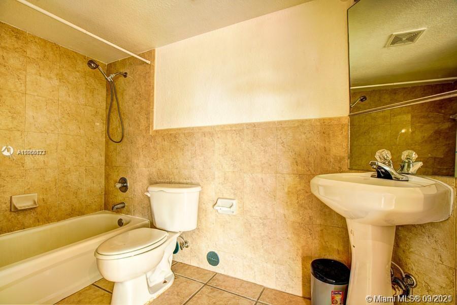 637 Southwest 3rd Street, Unit 206 Miami, FL 33130 - Photo 13 of 20 a bathroom with a sink toilet and shower