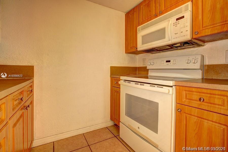 637 Southwest 3rd Street, Unit 206 Miami, FL 33130 - Photo 16 of 20 a stove top oven sitting inside of a kitchen