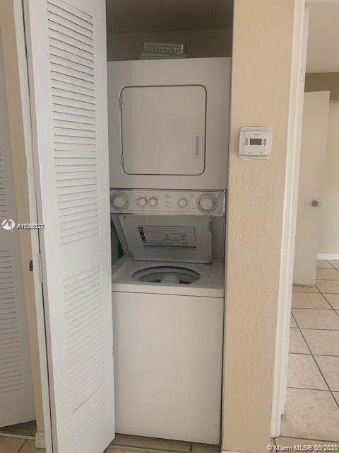 637 Southwest 3rd Street, Unit 206 Miami, FL 33130 - Photo 9 of 20 a utility room with dryer and washer