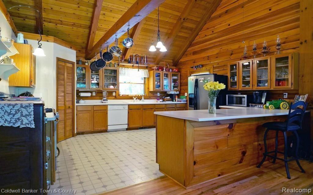6255 North Owosso Road Fowlerville, MI 48836 - Photo 17 of 31 Open and Bright Country Kitchen with glass door cabinety
