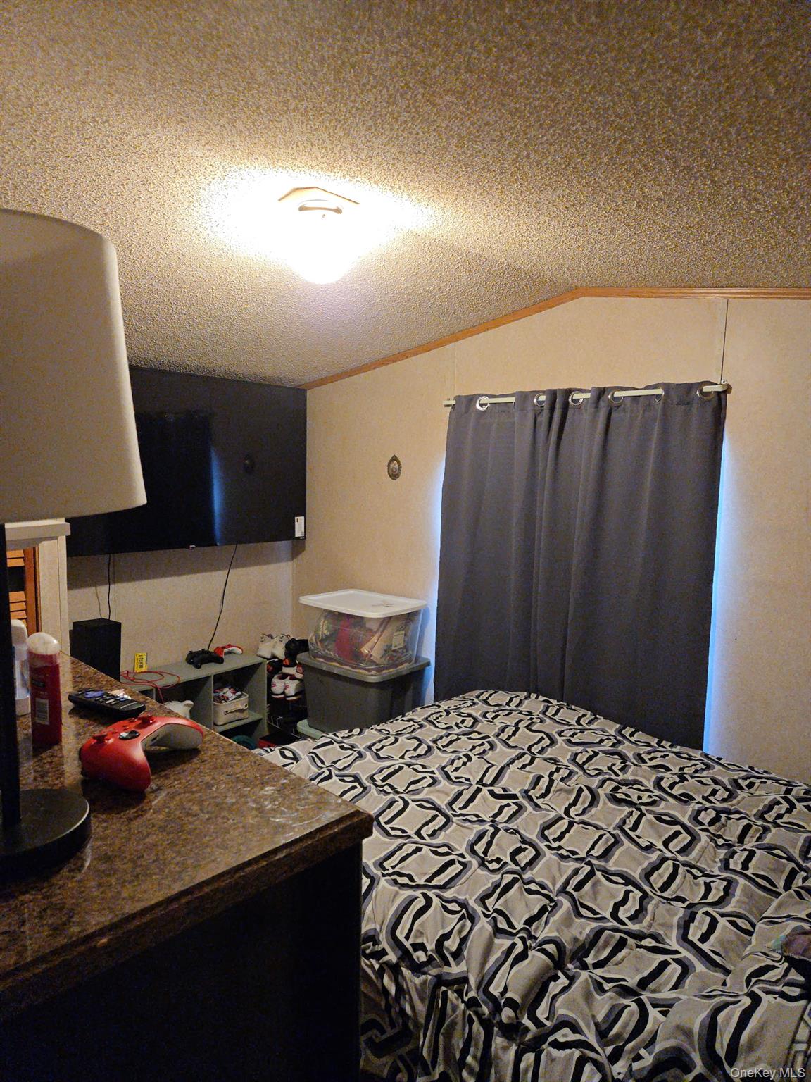 2701 Goethals Road North, Unit H4 Staten Island, NY 10303 - Photo 11 of 14 a bedroom with a bed and a lamp