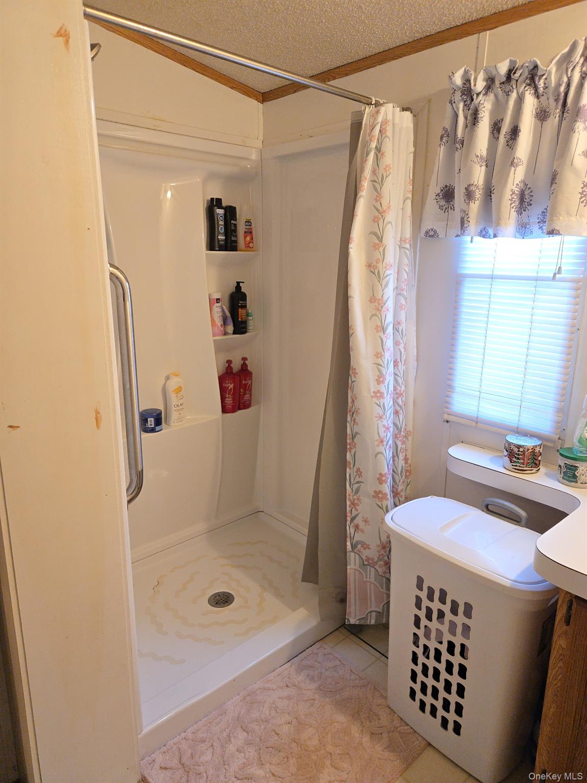 2701 Goethals Road North, Unit H4 Staten Island, NY 10303 - Photo 13 of 14 a bathroom with a sink a toilet and shower