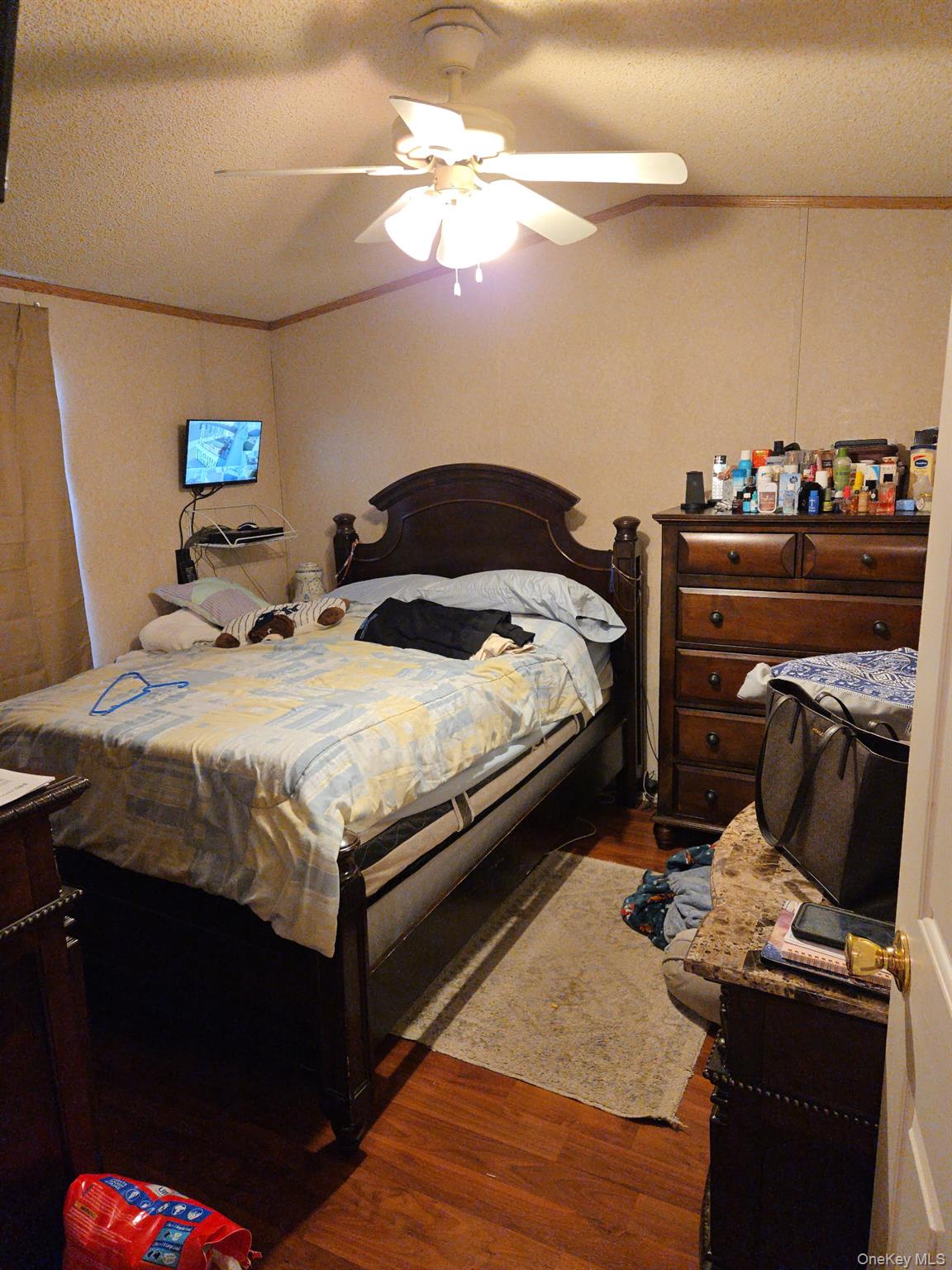2701 Goethals Road North, Unit H4 Staten Island, NY 10303 - Photo 14 of 14 a bedroom with a bed and a chandelier