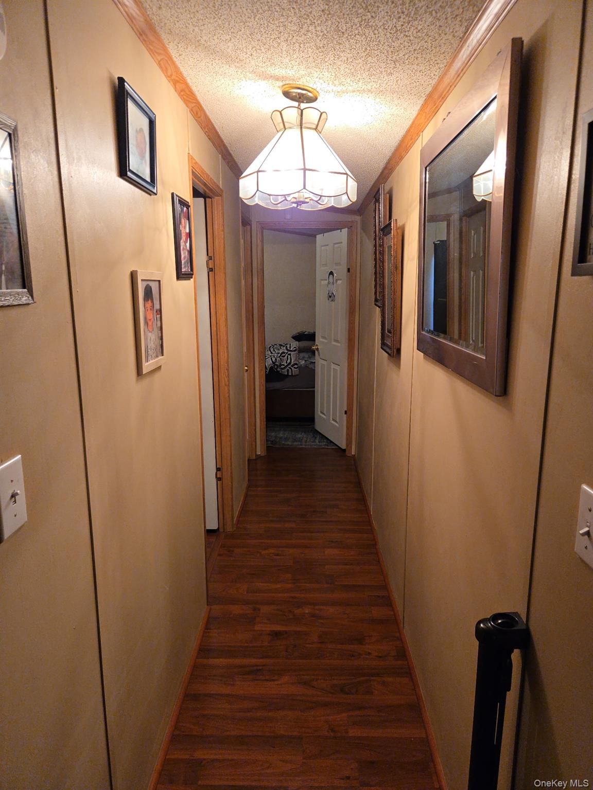 2701 Goethals Road North, Unit H4 Staten Island, NY 10303 - Photo 10 of 14 a view of a hallway with wooden floor and staircase