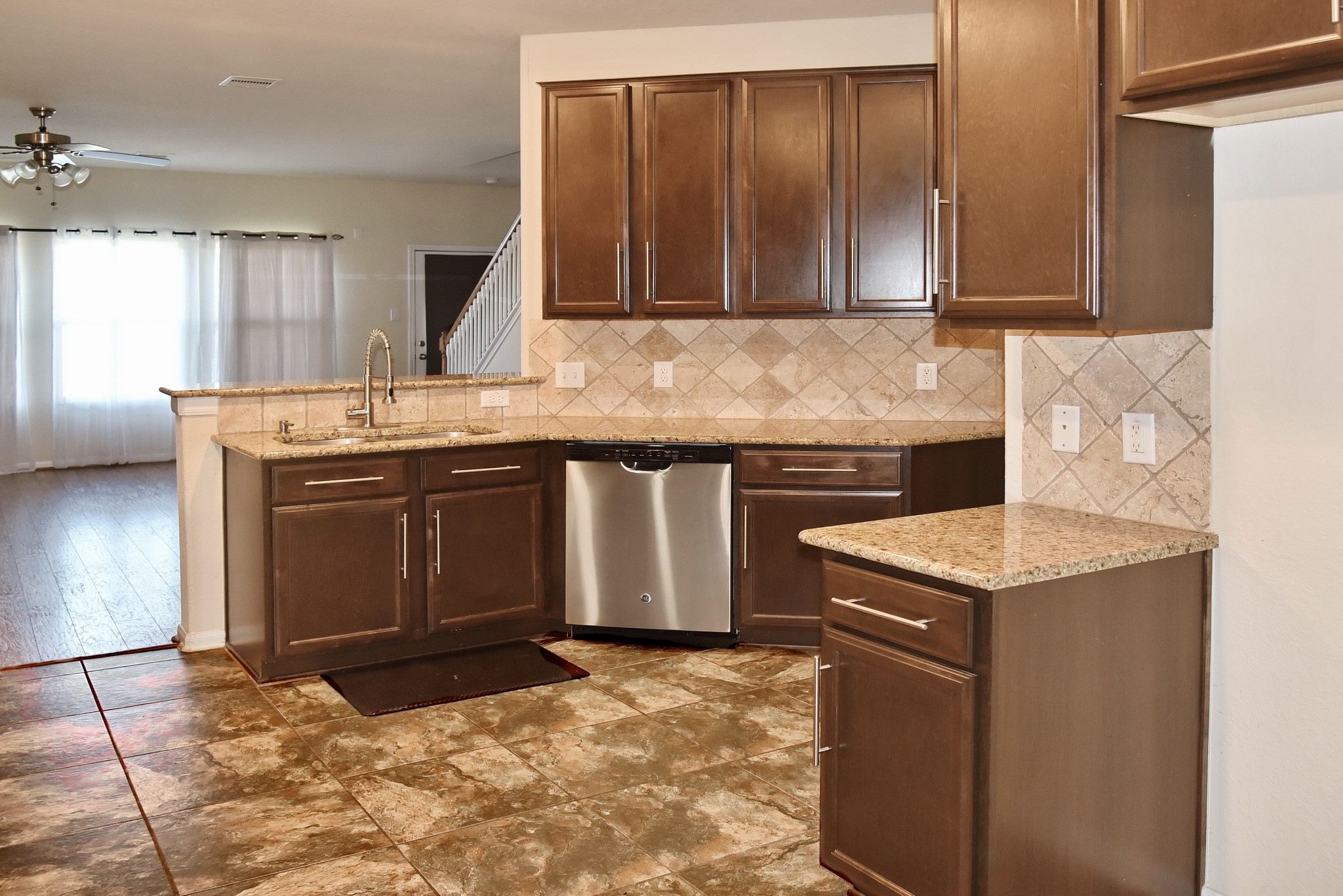 19211 Side Way Tomball, TX 77375 - Photo 14 of 36 a kitchen with stainless steel appliances granite countertop a sink stove and refrigerator