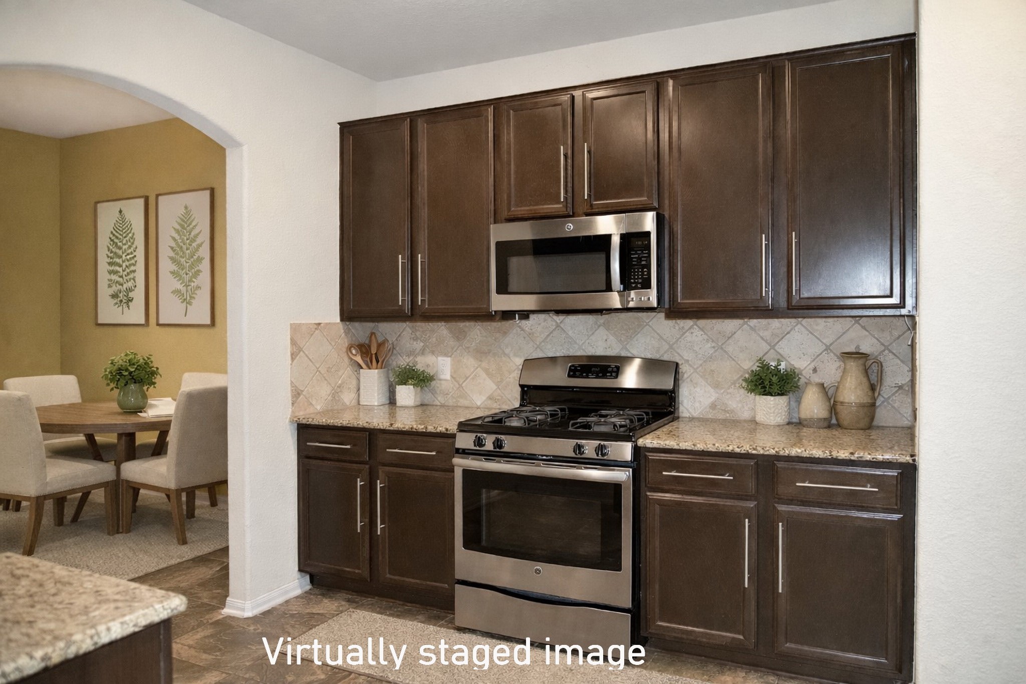 19211 Side Way Tomball, TX 77375 - Photo 15 of 36 a kitchen with granite countertop wooden cabinets and stainless steel appliances