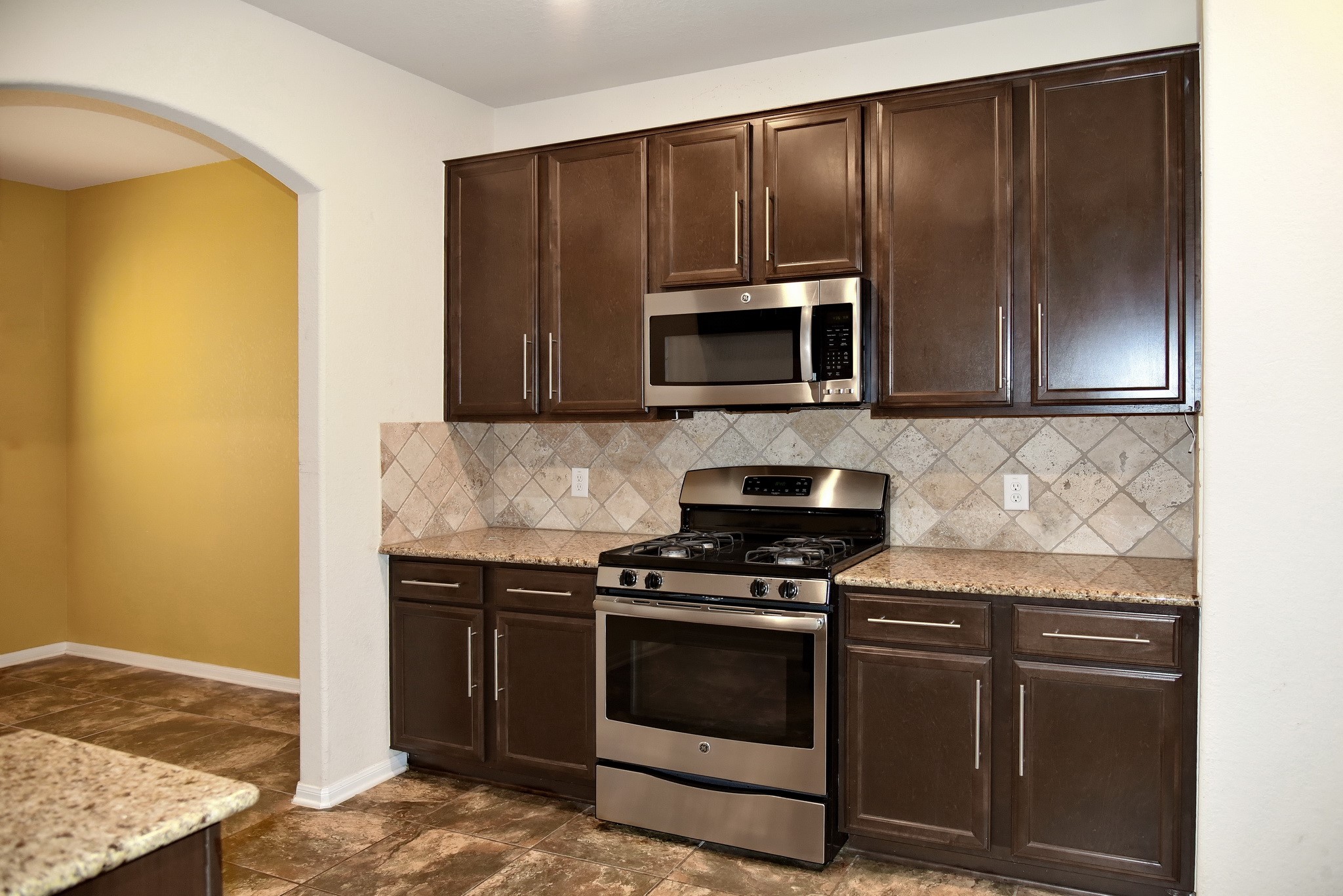 19211 Side Way Tomball, TX 77375 - Photo 16 of 36 a kitchen with granite countertop cabinets stainless steel appliances and a counter space