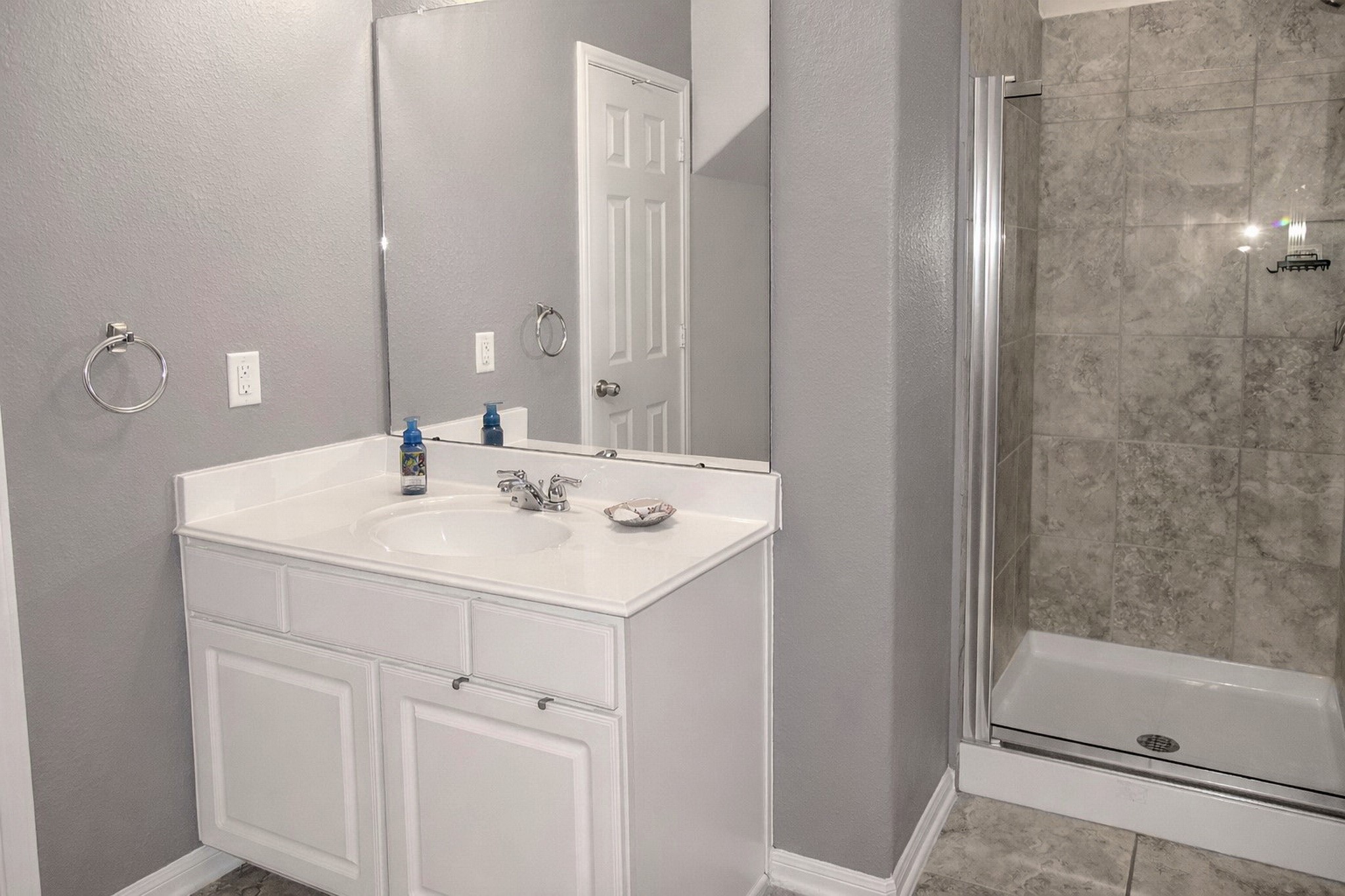 19211 Side Way Tomball, TX 77375 - Photo 21 of 36 a bathroom with a sink and a mirror