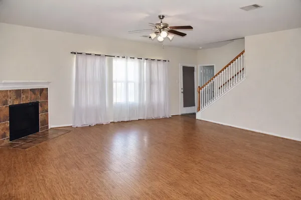 a dining room with furniture window and wooden floor