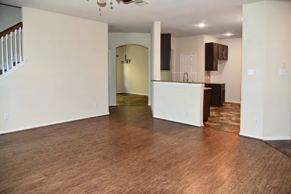 a kitchen with stainless steel appliances granite countertop a stove top oven a sink and dishwasher