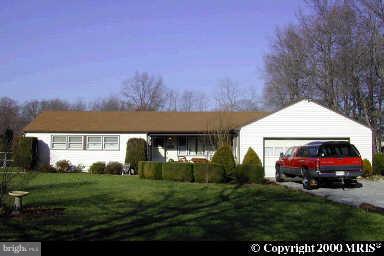 14911 Schall Road Accokeek, MD 20607 - Photo 1 of 1 a house view with a garden space