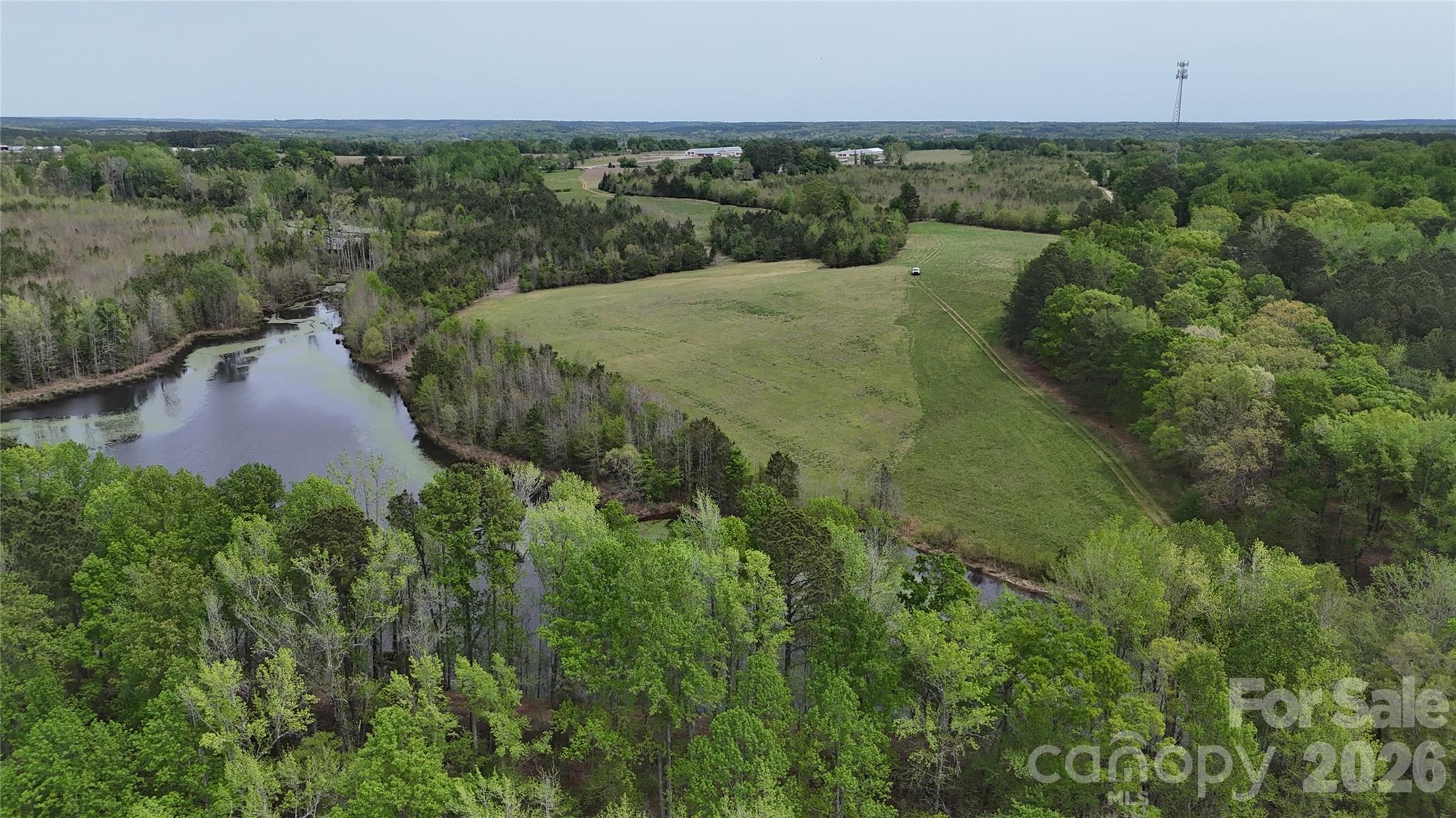 6377 Highway 52 Cheraw, SC 29520 - Photo 38 of 41 an aerial view of a houses with outdoor space and trees all around
