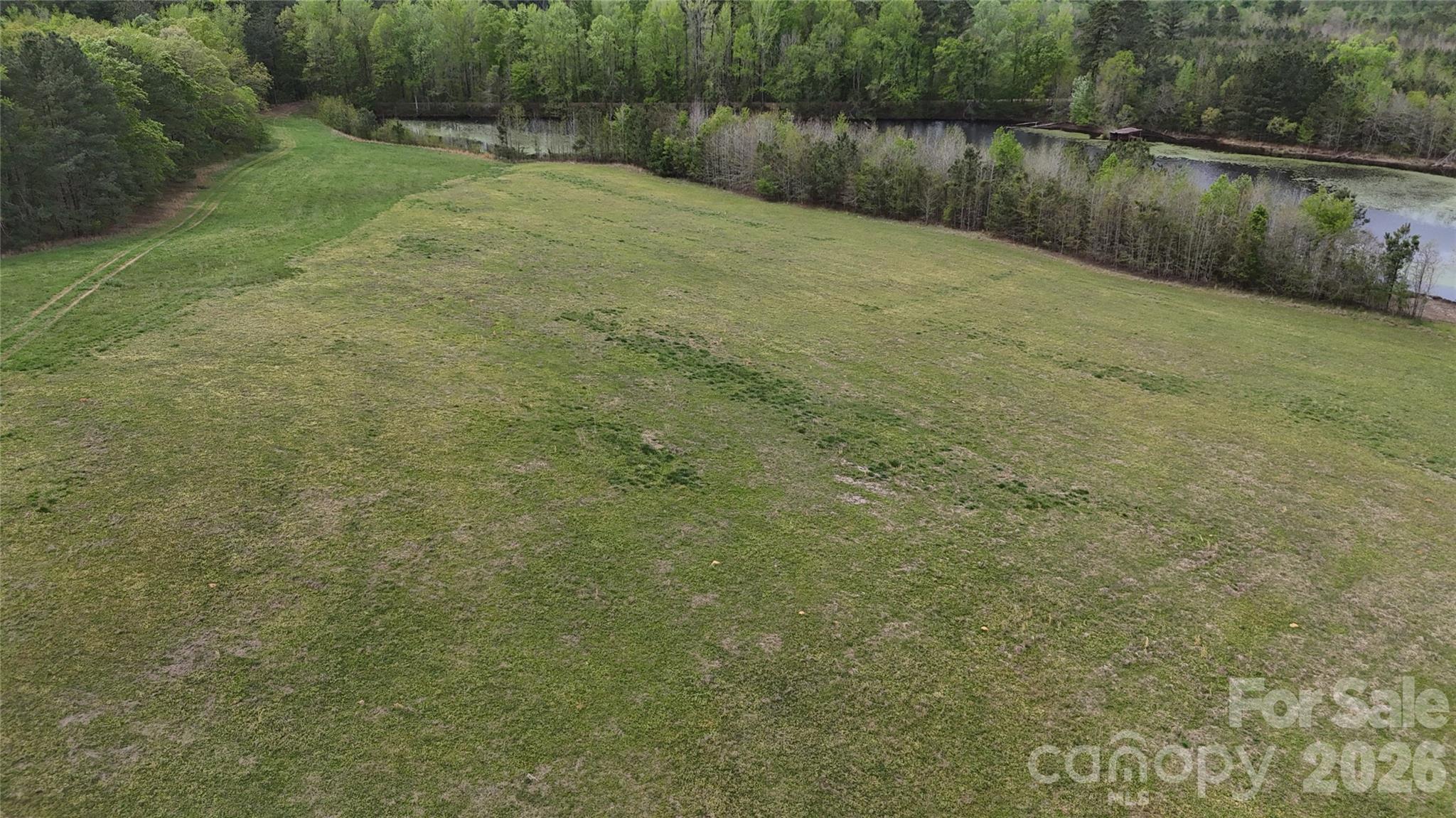 6377 Highway 52 Cheraw, SC 29520 - Photo 40 of 41 a view of a lake view with a wooden bridge