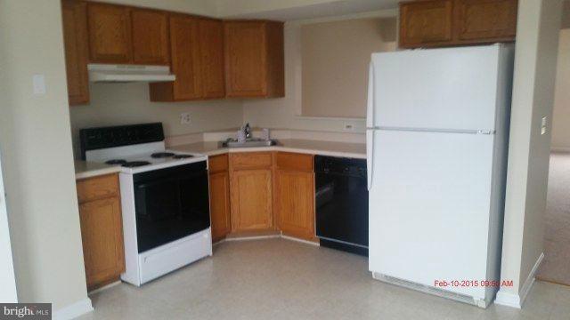 641 Hunting Fields Road Middle River, MD 21220 - Photo 6 of 7 a utility room with cabinets washer and dryer