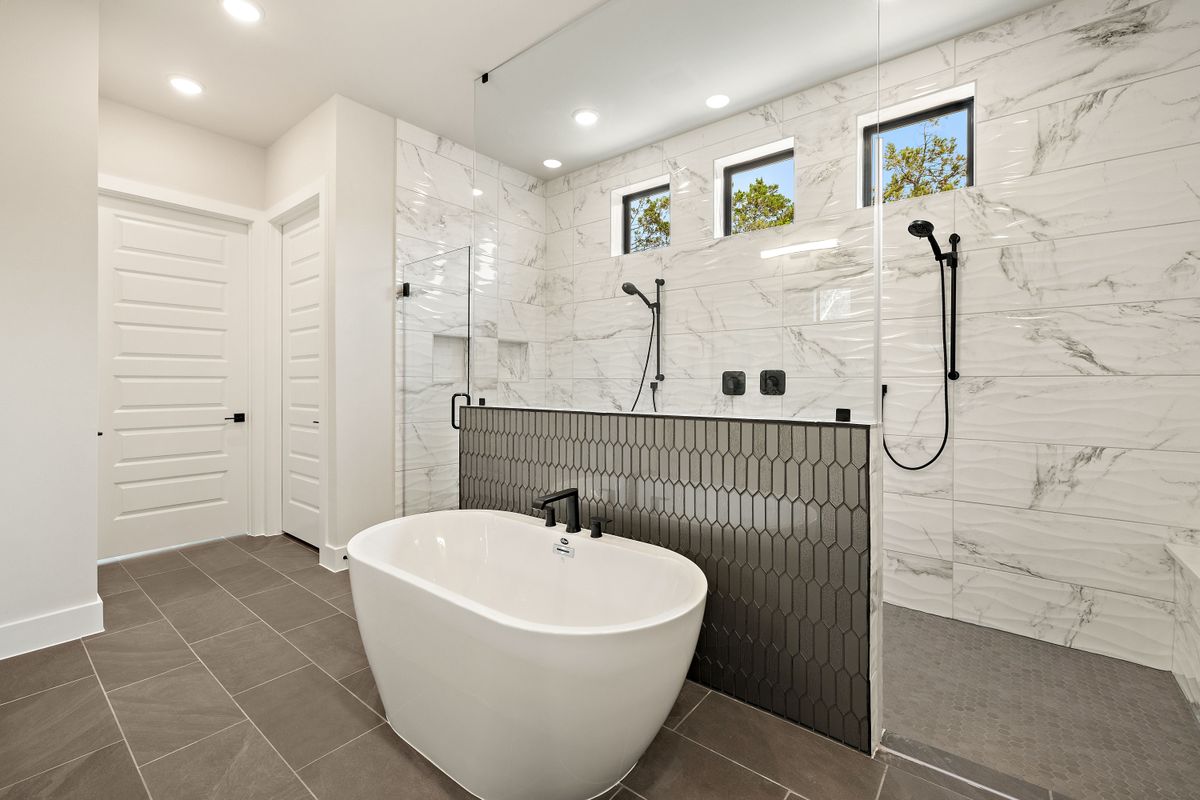 17809 Maritime Point Jonestown, TX 78645 - Photo 15 of 26 a bathroom with a bathtub and shower