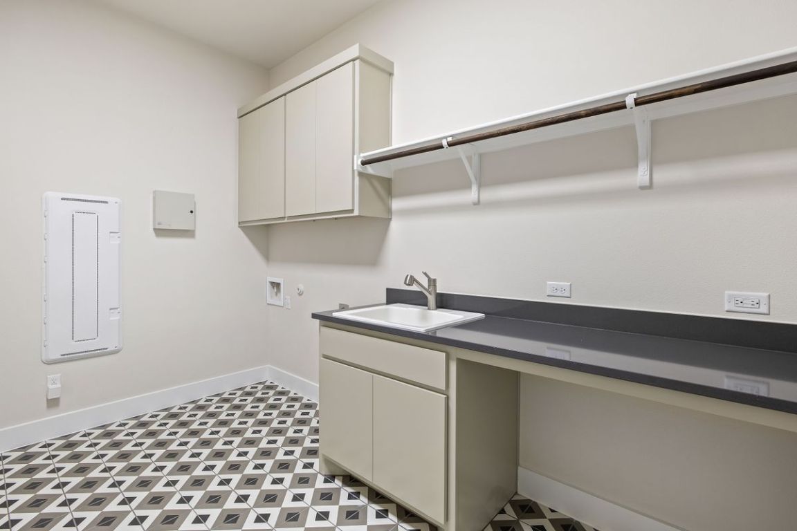 17809 Maritime Point Jonestown, TX 78645 - Photo 20 of 26 a utility room with a sink dryer and washer
