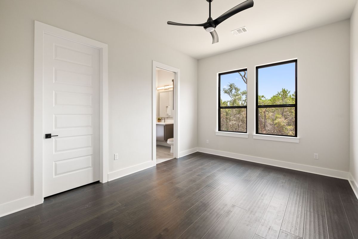 17809 Maritime Point Jonestown, TX 78645 - Photo 21 of 26 wooden floor in an empty room with a window