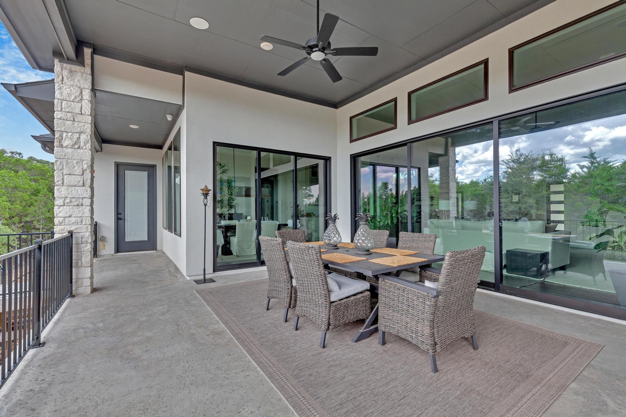 17809 Maritime Point Jonestown, TX 78645 - Photo 23 of 26 a dining room with furniture a chandelier and glass door