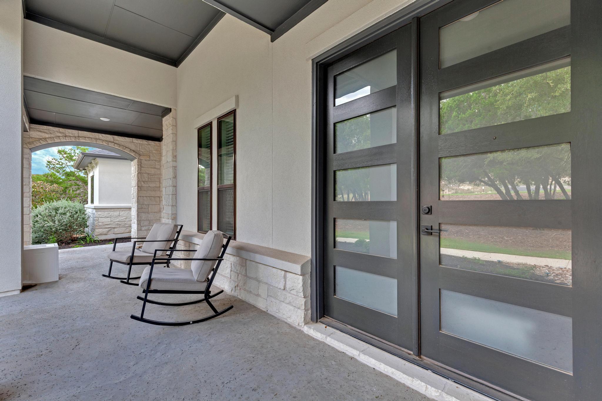 17809 Maritime Point Jonestown, TX 78645 - Photo 4 of 26 a living room with furniture and a floor to ceiling window