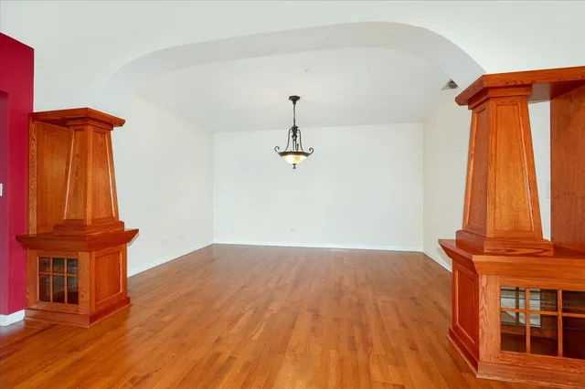 a view of a room with wooden floor and stairs