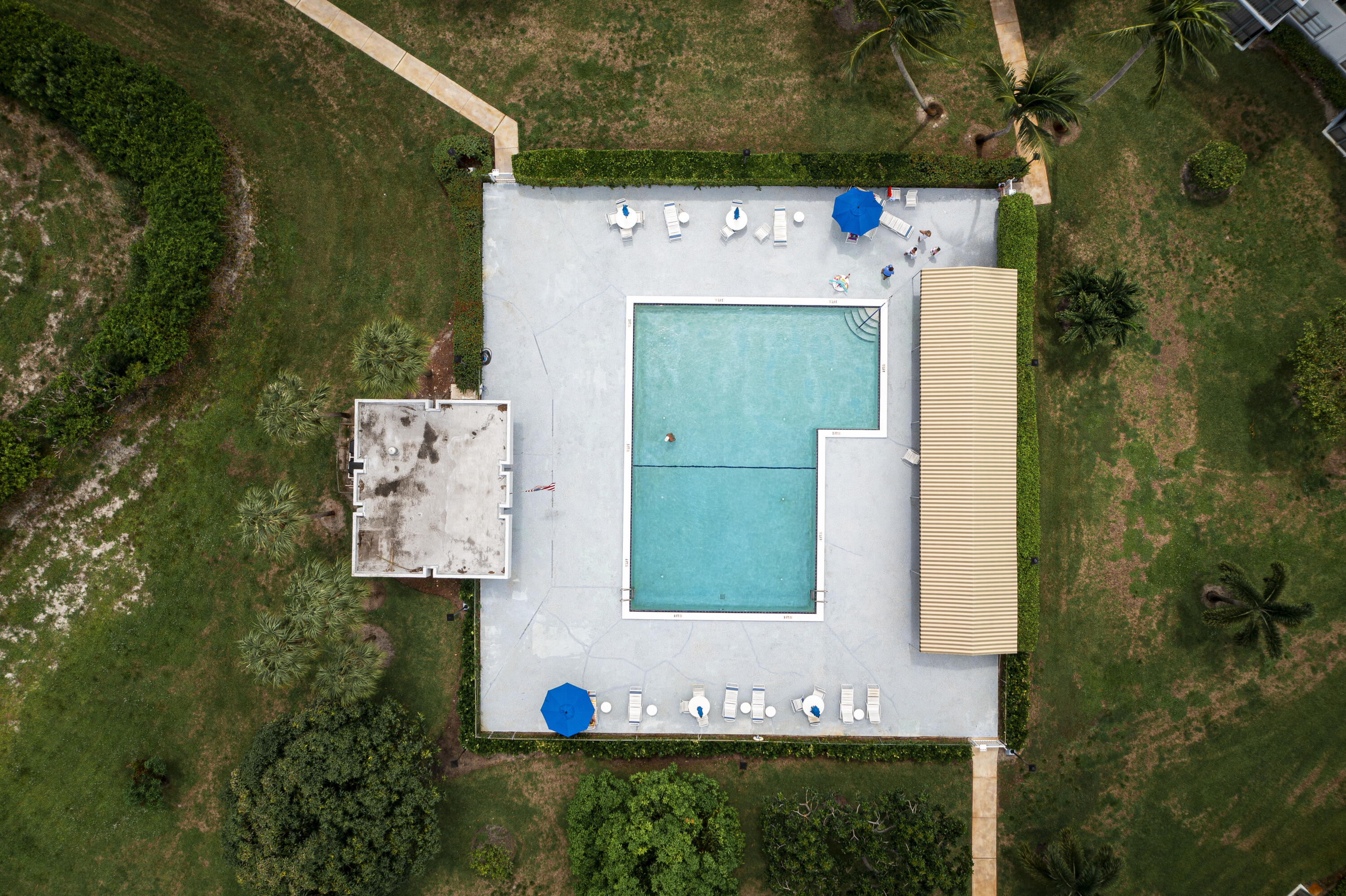 198 Northwest 67th Street, Unit 302 Boca Raton, FL 33487 - Photo 31 of 32 drone over pool