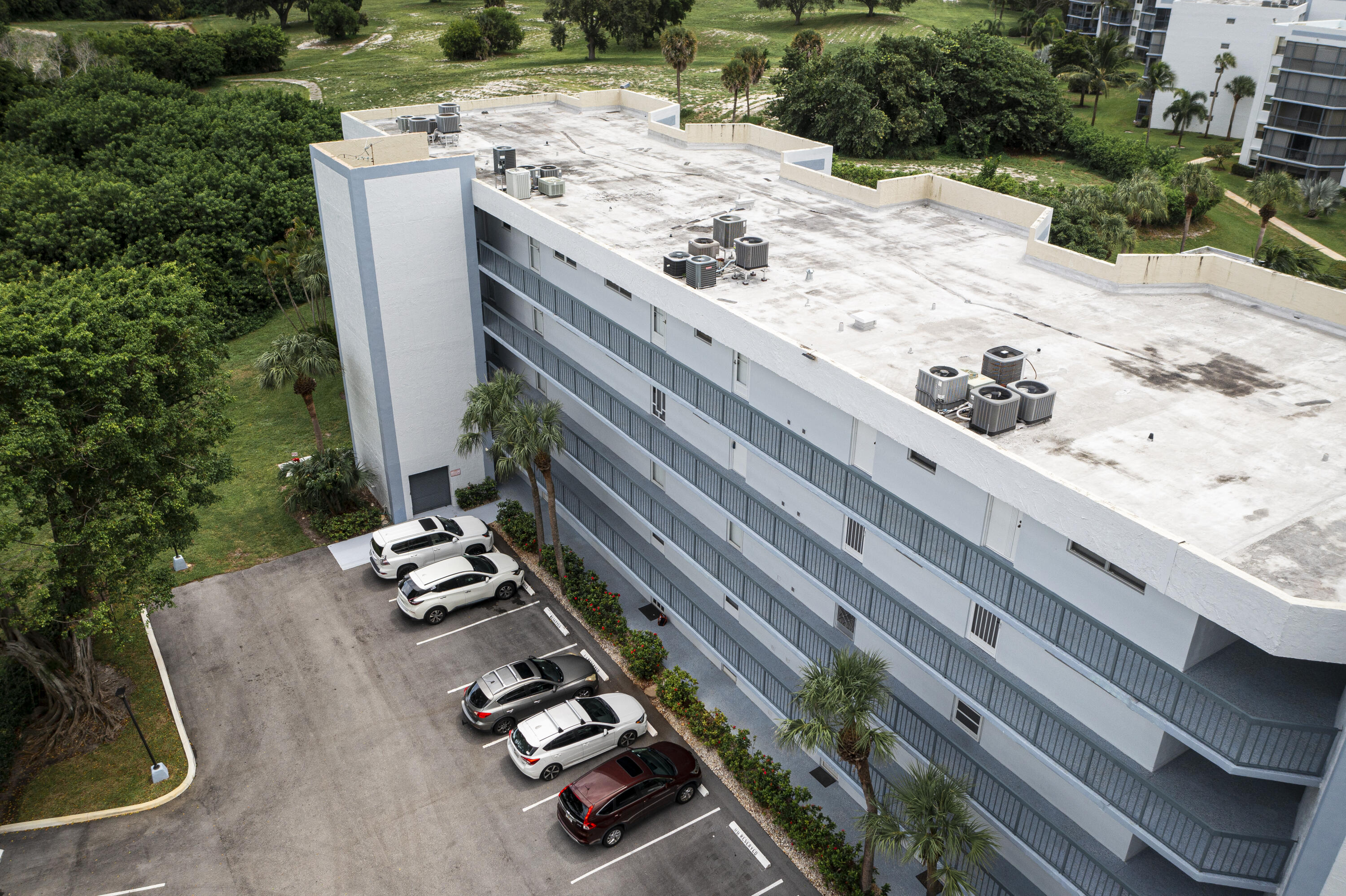 198 Northwest 67th Street, Unit 302 Boca Raton, FL 33487 - Photo 32 of 32 drone view of roof & building