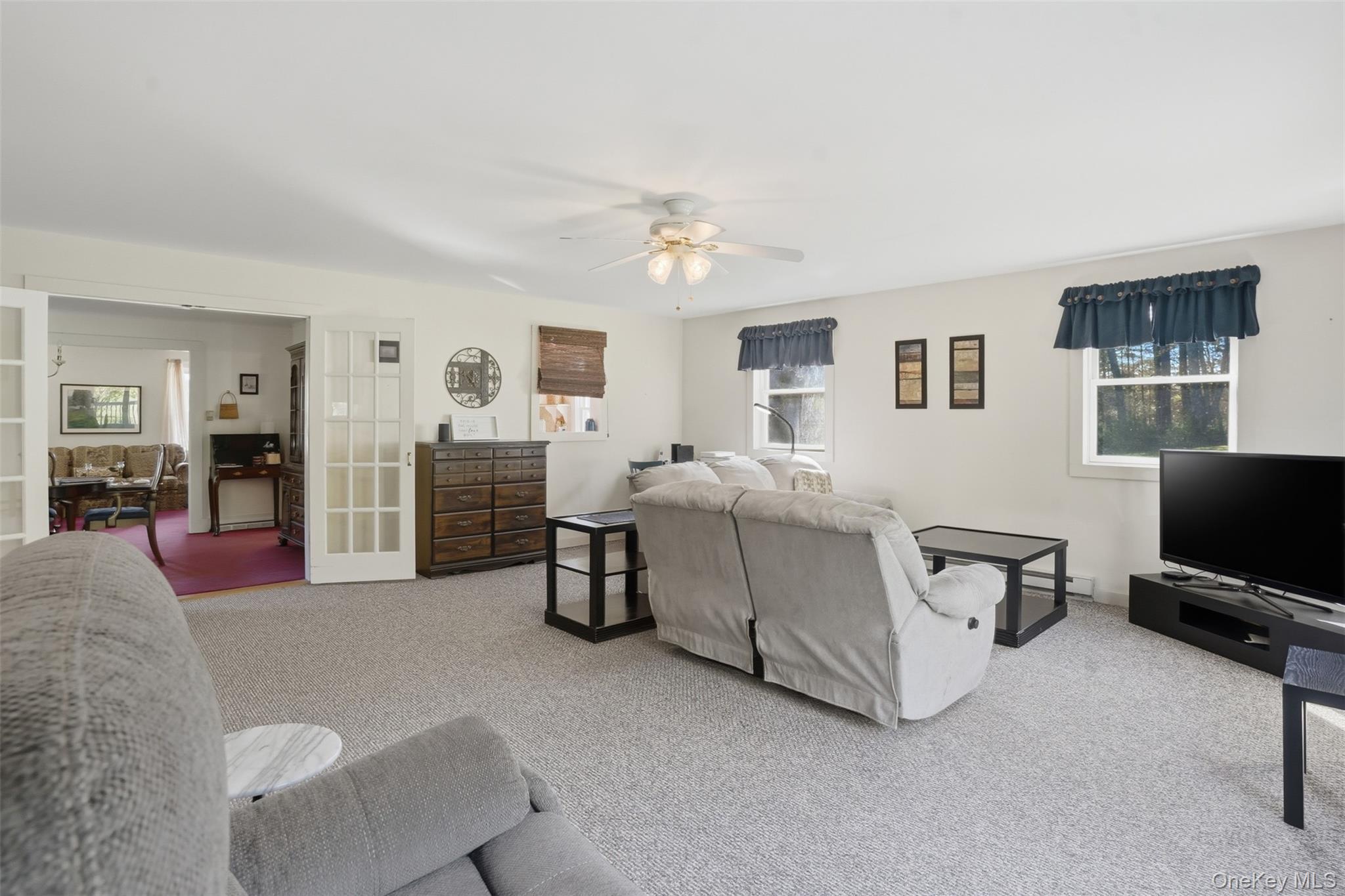 114 Proctor Road Eldred, NY 12732 - Photo 17 of 38 a living room with furniture and a flat screen tv