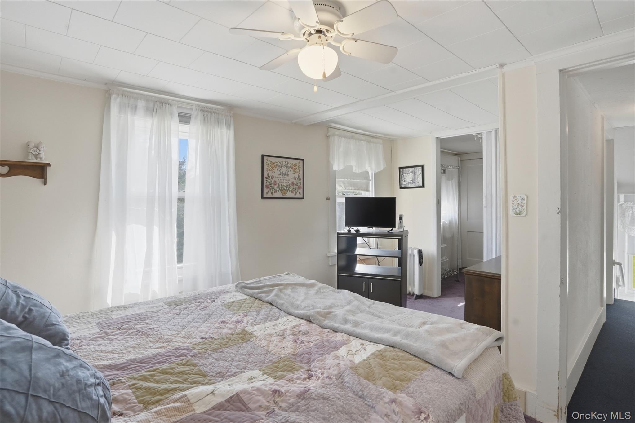 114 Proctor Road Eldred, NY 12732 - Photo 25 of 38 a bedroom with a bed and a flat tv screen on dresser