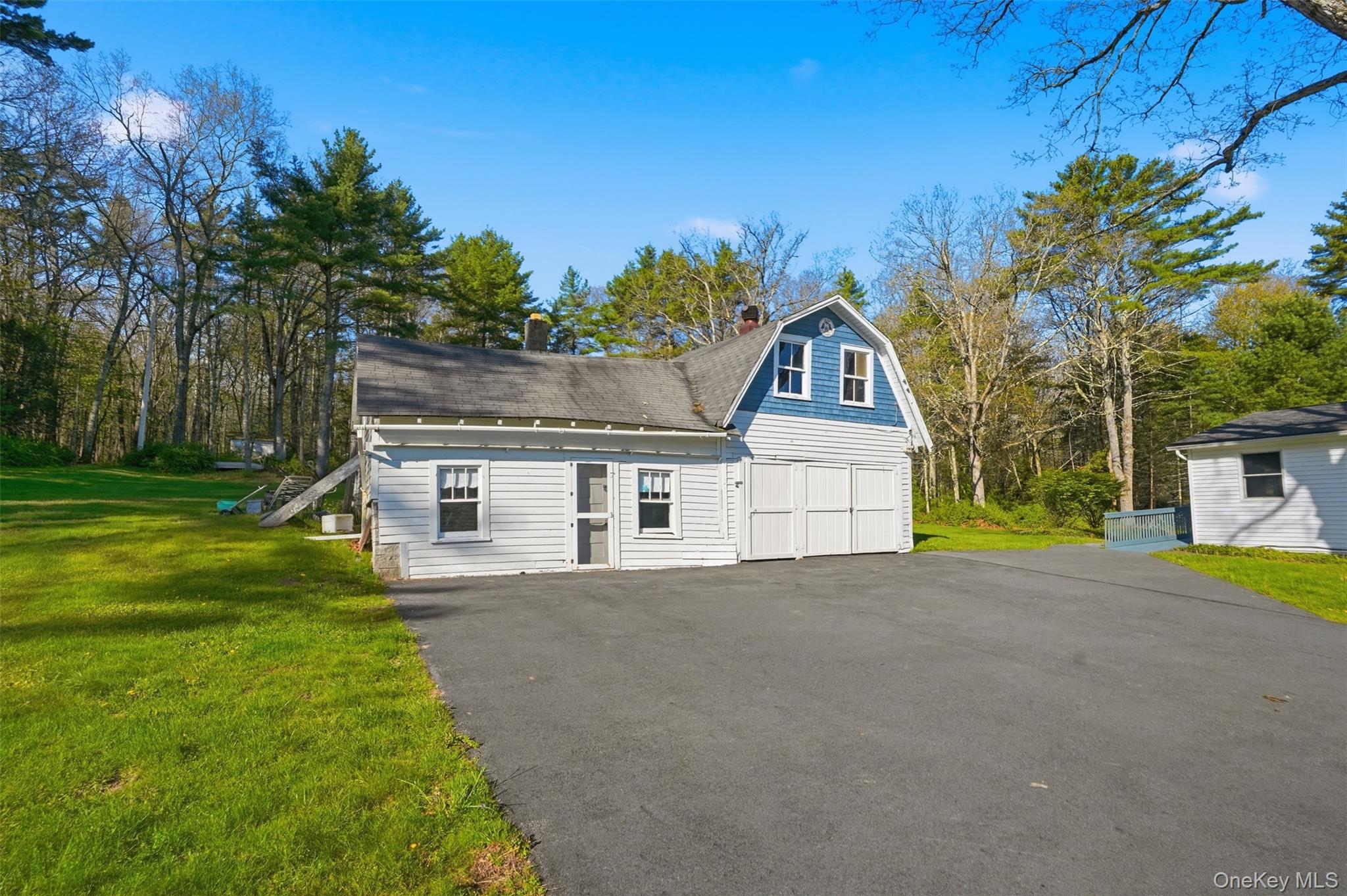 114 Proctor Road Eldred, NY 12732 - Photo 8 of 38 a front view of a house with a yard and garage