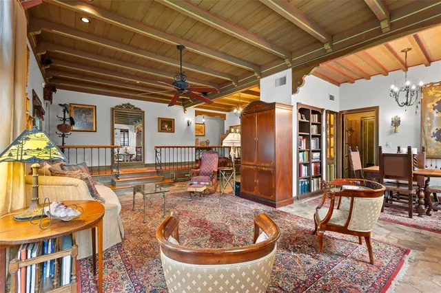 a outdoor space with lots of furniture and water view