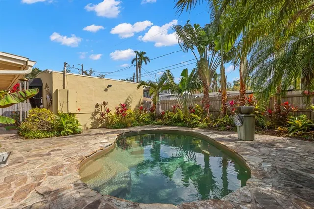 a swimming pool with wooden fence