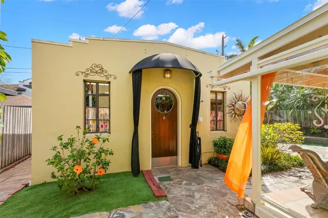 a front view of a house with garden