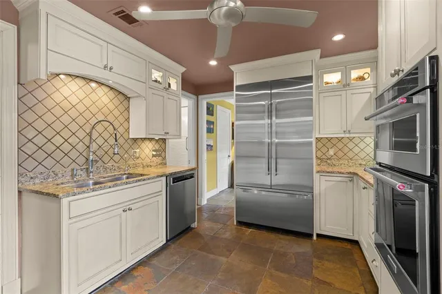 a spacious bedroom with a bed and large windows