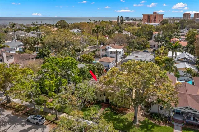 an aerial view of multiple houses with yard