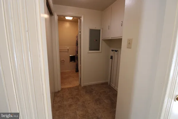 a view of a hallway with a bathroom