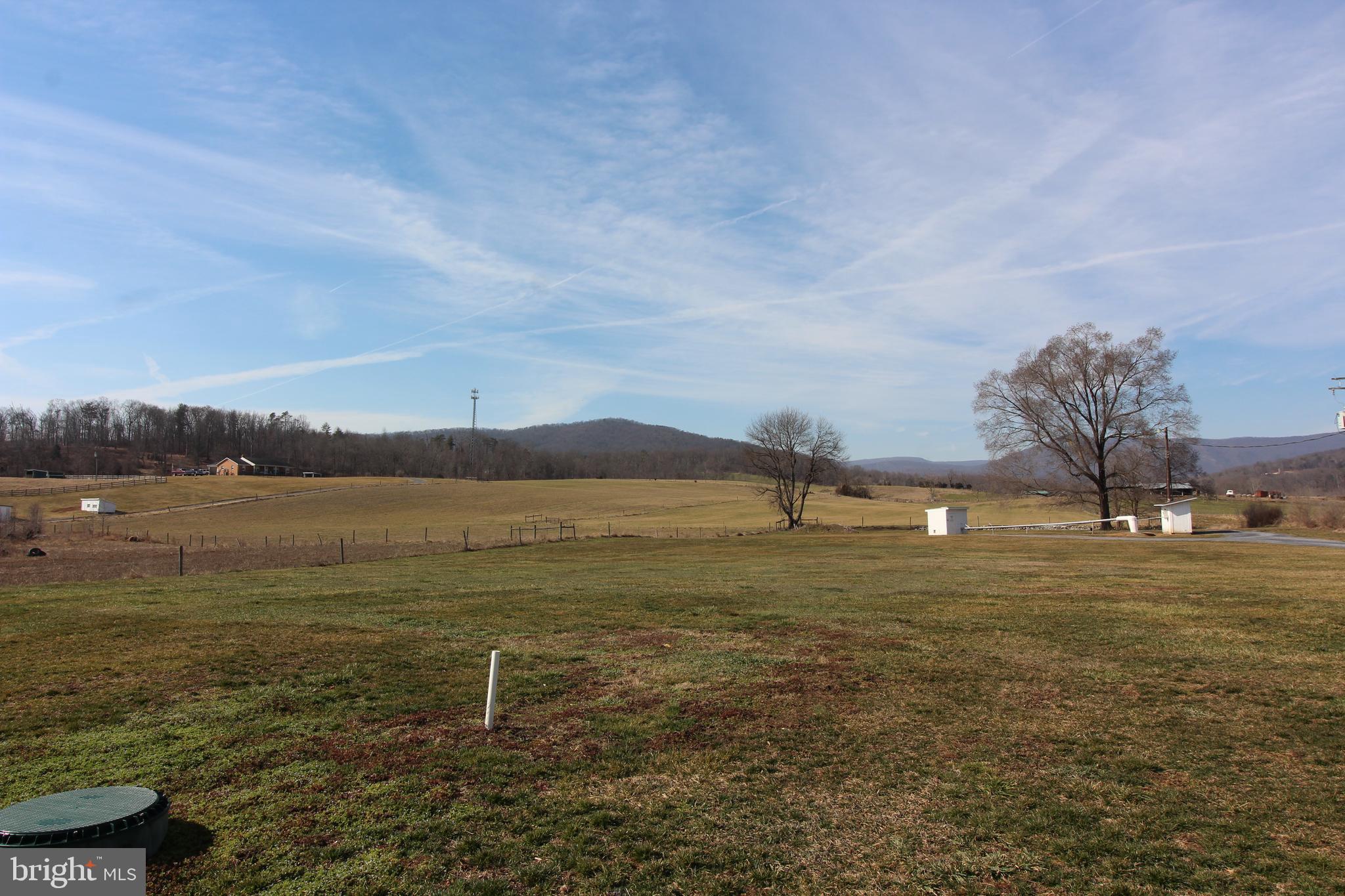 18947 Senedo Road, Unit 4 Edinburg, VA 22824 - Photo 14 of 15 a view of a lake from a yard