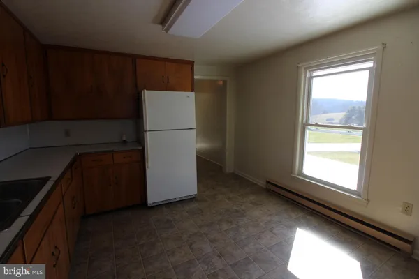 a utility room with closet dryer and washer